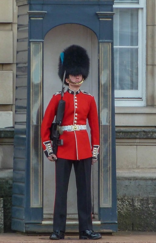 Grenadier Guard stading at atention outside Buckingham Palace